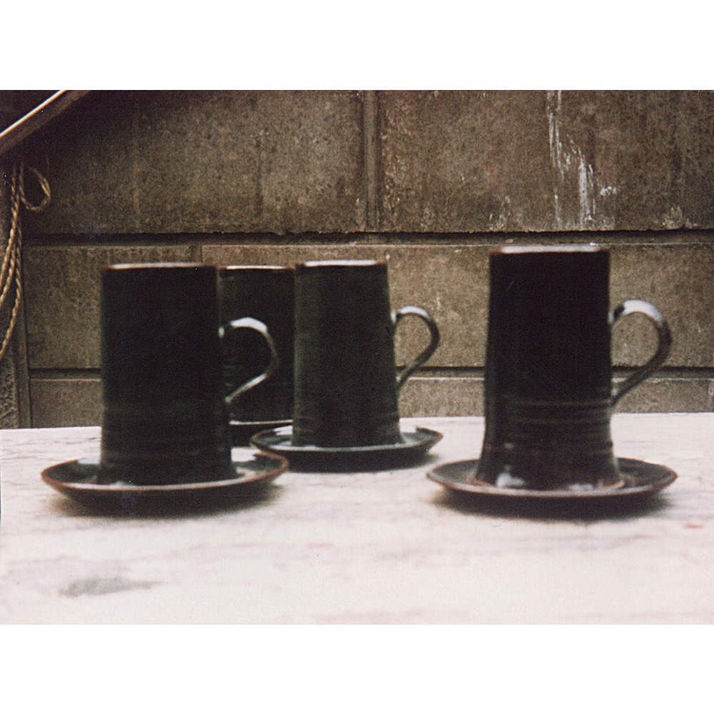 Four stoneware hand thrown beer mugs and saucers 1965